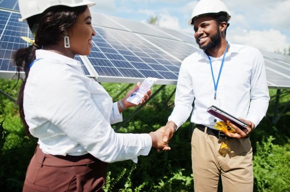 african-american-technician-checks-maintenance-solar-panels-group-three-black-engineers-meeting-solar-station-make-deal-with-money