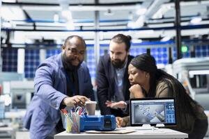 multiethnic-master-engineers-group-examining-solar-panels-production-in-a-factory-ensuring-a-good-manufacturing-process-and-production-with-teamwork-industrial-renewable-energy-photo
